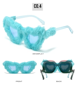 Detailed views of heart-shaped sunglasses with blue plush faux fur frames and clear lenses