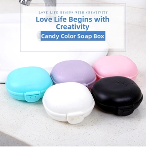 Close-up of portable candy-colored soap boxes with secure snap lids on a clean sink counter
