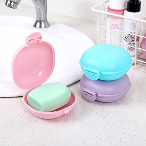Set of portable waterproof travel soap boxes with lids in pink blue and purple colors