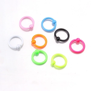 Neon color captive bead rings in various shades like blue, pink, and green for body piercing