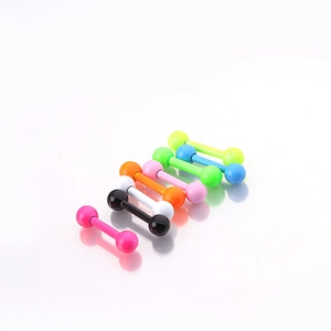 Macro shot of colorful neon painted stainless steel studs on a white reflective surface