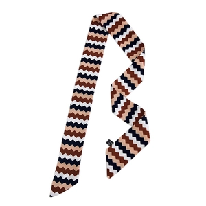 Narrow silk scarf with brown and navy V-shaped wave patterns on a white background