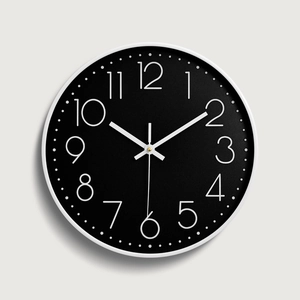 Modern 12-inch minimalist round wall clock with white frame and black dial for living room