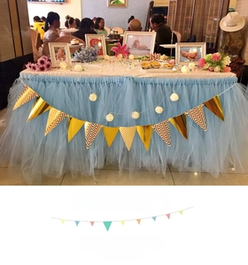 Detail of Nordic gold mirror and wavy pattern triangle bunting banners for party decor