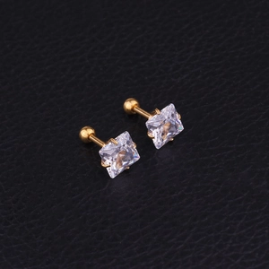 Pair of gold stainless steel stud earrings featuring square zircon crystals on black leather