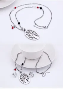 Detail of life tree jewelry set with oval pendant, colored beads and sparkling stones