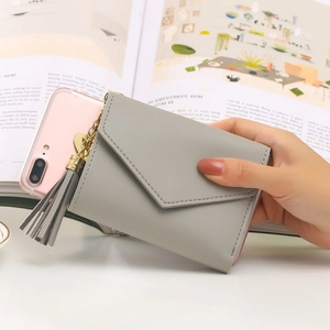 Short grey PU leather wallet for women featuring a stylish tassel pendant and fold design