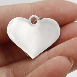 Polished silver heart pendant with crystal detail made of vacuum-plated stainless steel