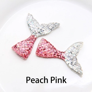 Detail of peach red glitter mermaid tail accessories for DIY jewelry and crafts