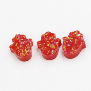 Three red synthetic opal Hamsa hand charms with sparkling gold resin flakes for DIY jewelry