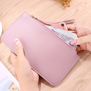 Fashionable pink long leather wallet for women with wrist strap and large phone capacity