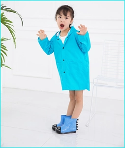 Blue dinosaur-themed children's raincoat and matching boots set for outdoor rain protection