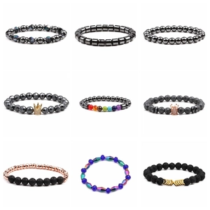 Detailed grid view of diverse magnetic bracelets with crown charms and volcanic stones