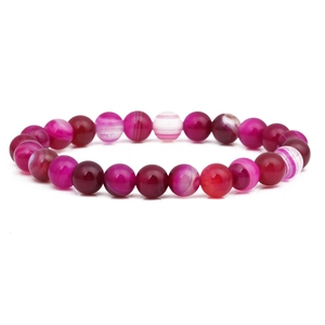 Pink and purple striped agate bead bracelet with natural stone texture on white background