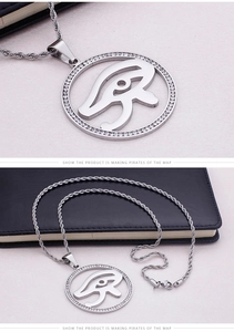 Macro view of Eye of Horus pendant necklace with sparkling white rhinestones