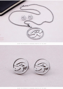Detailed view of silver Eye of Horus jewelry set with sparkling crystal accents