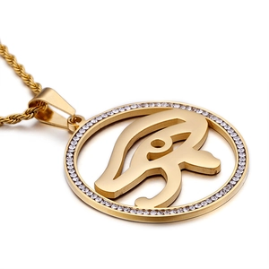 Gold Eye of Horus pendant necklace with crystal accents and classic twist chain