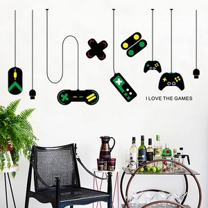Detail of gamer wall decals featuring colorful game controller silhouettes and slogans
