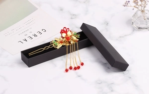 Exquisite golden hair pin with red floral accents and five tassels in a black gift box