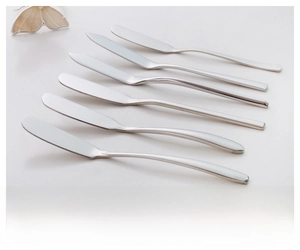 Detailed view of six stainless steel butter knives with unique minimalist curved handles