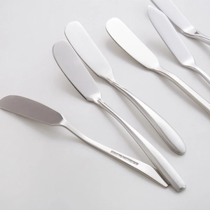 Set of five 304 stainless steel butter knives with polished silver finish on white background