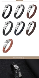 Macro detail of braided leather bracelets featuring a stainless steel snake head clasp