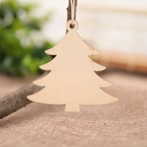 Macro shot of natural wood Christmas tree pendants with hemp rope for rustic decor