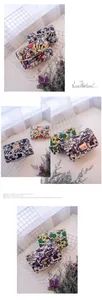 Detail of colorful pop art poker printed crossbody chain bags with metal buckles
