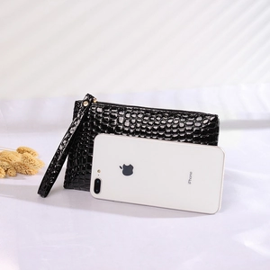 Glossy black crocodile pattern wristlet clutch with secure zipper and wrist strap