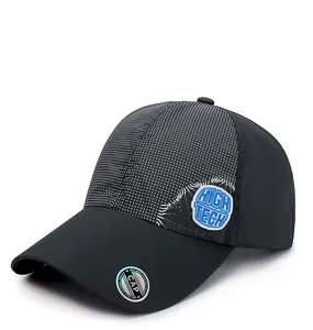 Detail of a black quick-dry baseball cap with high-tech badge and holographic sticker