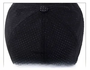 Detailed macro view of the breathable mesh fabric and stitching on the black baseball cap