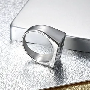 Macro detail of men's vintage silver ring with number 13 engraving and square face