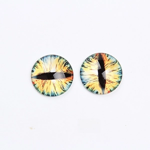 Detail showing yellow-green glass cabochon eyes with slit pupils for DIY crafts