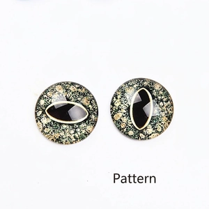 Detail showing macro view of green animal glass eye cabochons for DIY crafts