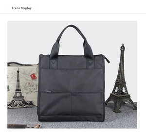 Detailansicht der schwarzen Nylon-Aktentasche mit mehreren Taschen und zwei Griffen