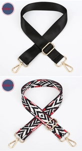 Close-up of ethnic style woven adjustable bag straps with golden metal lobster clasps
