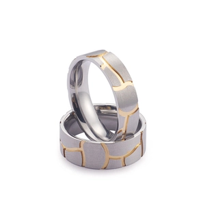 Brushed titanium steel ring set with gold grooved lines and polished inner band