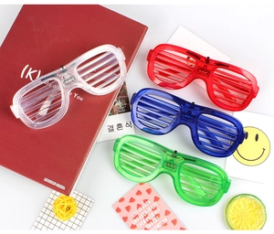 Four pairs of LED shutter glasses in red, blue, green and clear on a white background