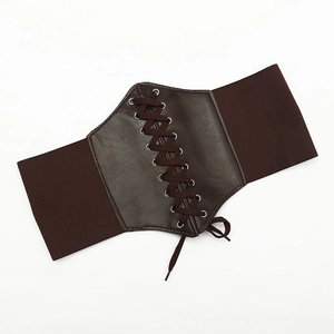 Detail of dark brown elastic corset belt with faux leather lace-up front and metal eyelets