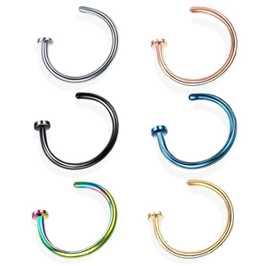 Multiple colorful C-shaped stainless steel nose rings in gold, silver, black, and blue
