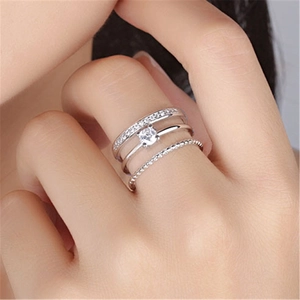 Three-layer adjustable silver rings set with sparkling clear zircons on model hand