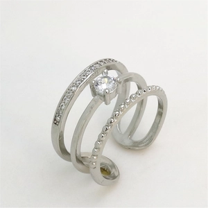 Macro shot of silver triple-layer adjustable ring with center diamond and pavé accents