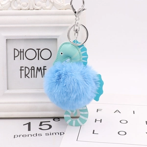 Cute blue seahorse pompom keychain with soft faux fur and silver metal ring holder