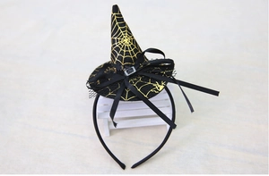 Detail of Halloween witch hat headband with gold spider web pattern and black mesh veil