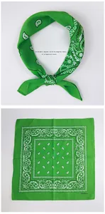 Detail of green 100% cotton bandana featuring a classic white paisley pattern print