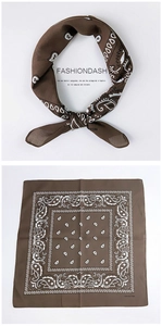 Detail view of 100% cotton square bandana featuring classic brown paisley patterns