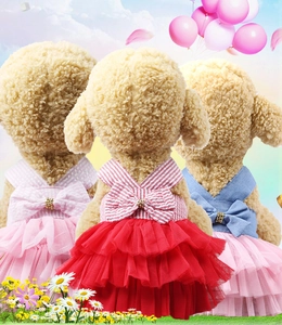 Detail of pet princess dresses with layered mesh skirts and large bowknots for small dogs