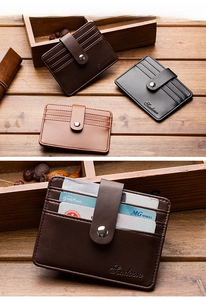 Macro detail of PU leather card holder showing multiple slots and secure metal snap closure