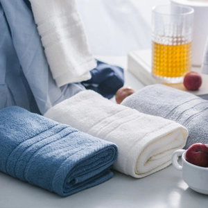 Close-up of white, blue and grey micro-fiber beauty towels with soft ribbed texture