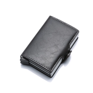 Detail view of the sleek black PU leather texture and aluminum pop-up card mechanism